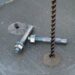 Concrete slab with a vertical rebar and two expansion anchor bolts